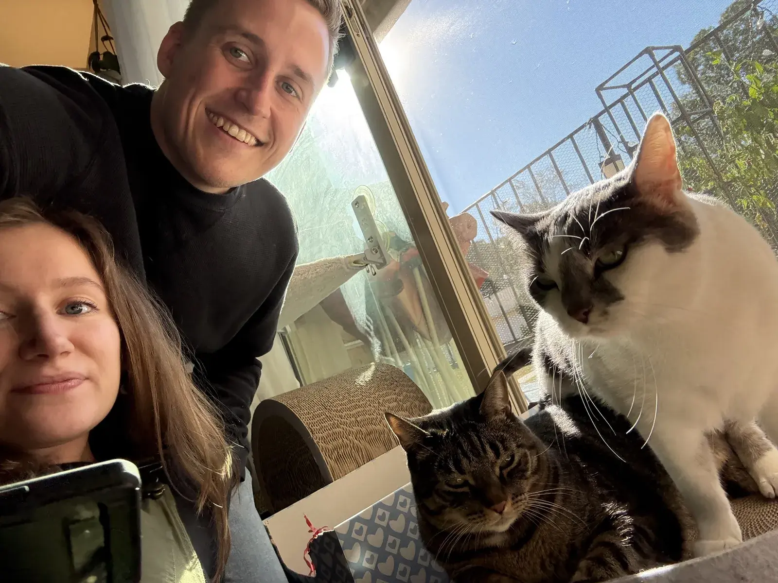 Tanner and Tara with Honey and Theo beside the original Scratch Canvas box.