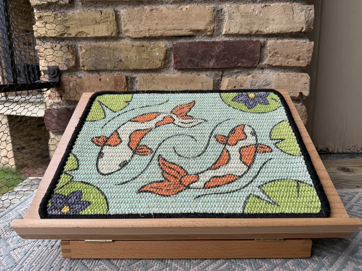 Koi Scratch Canvas panel on a wooden easel after about two months of daily household use.